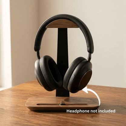 Clean product photo of a minimalist headphone stand with pen holder on a wooden desk.