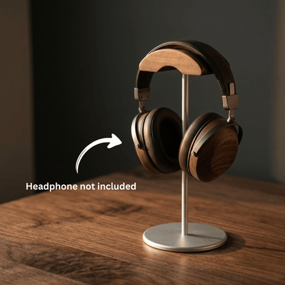 Desk headphone stand on wooden surface with note that headphones are not included