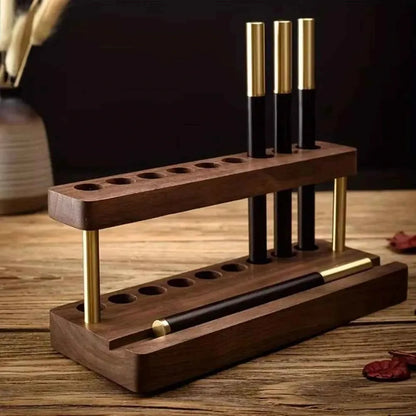 Walnut desk phone stand with pen holder placed beside everyday workspace essentials