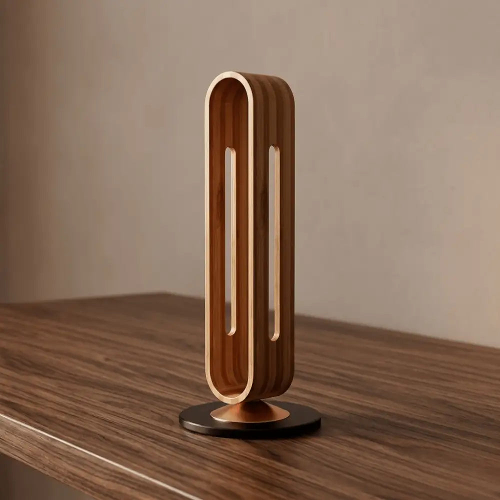 empty wooden headphone stand on dark wood desk surface