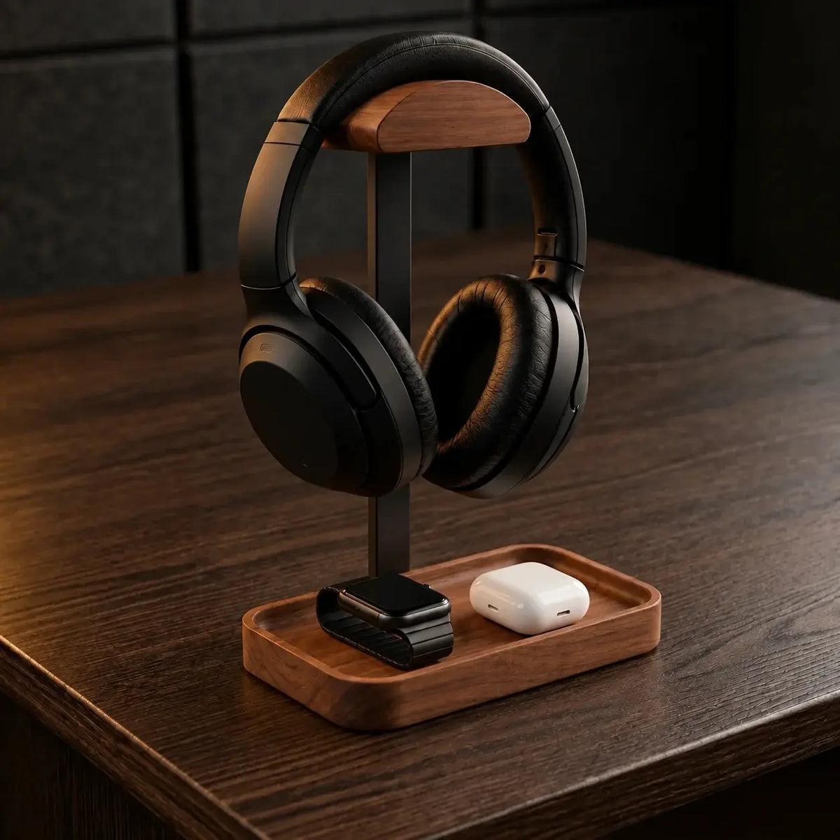 Solid walnut headphone stand with integrated tray on a desk