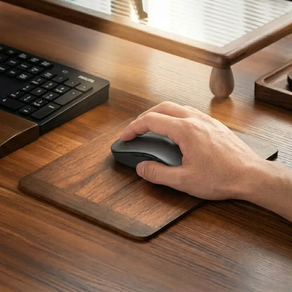Hand Using Mouse On Solid Walnut Mouse Pad In Workspace