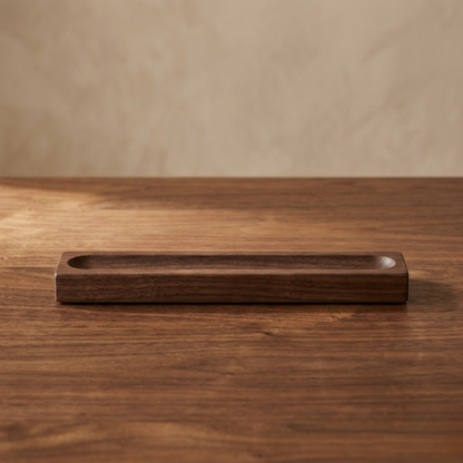Single-slot bamboo desk pen tray on a wooden desk surface