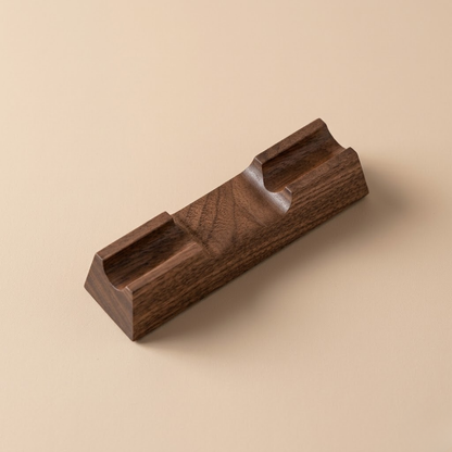 Single-slot walnut desk pen rest product photo on a wooden desk