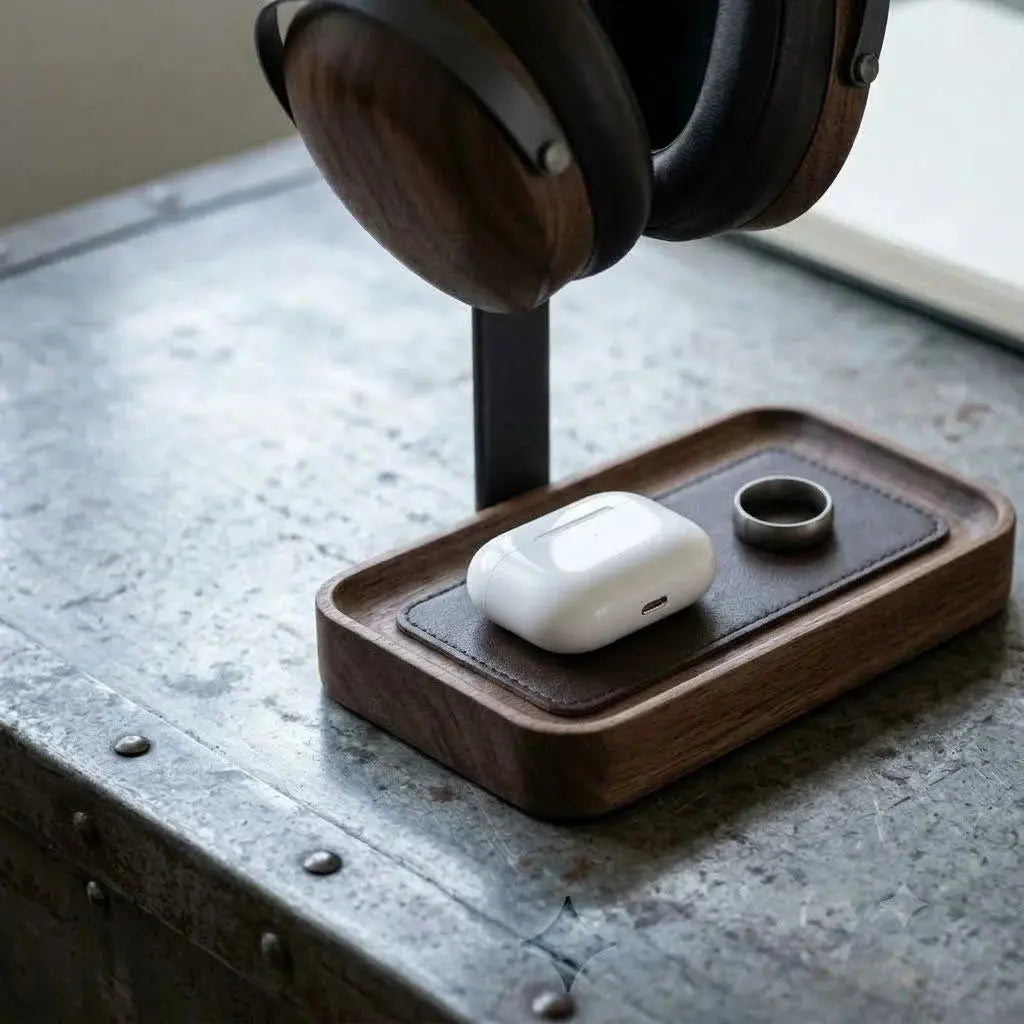 Solid walnut headphone stand with detailed wood grain and integrated tray