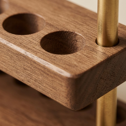 Close-up detail showing the wood grain of a walnut desk phone stand